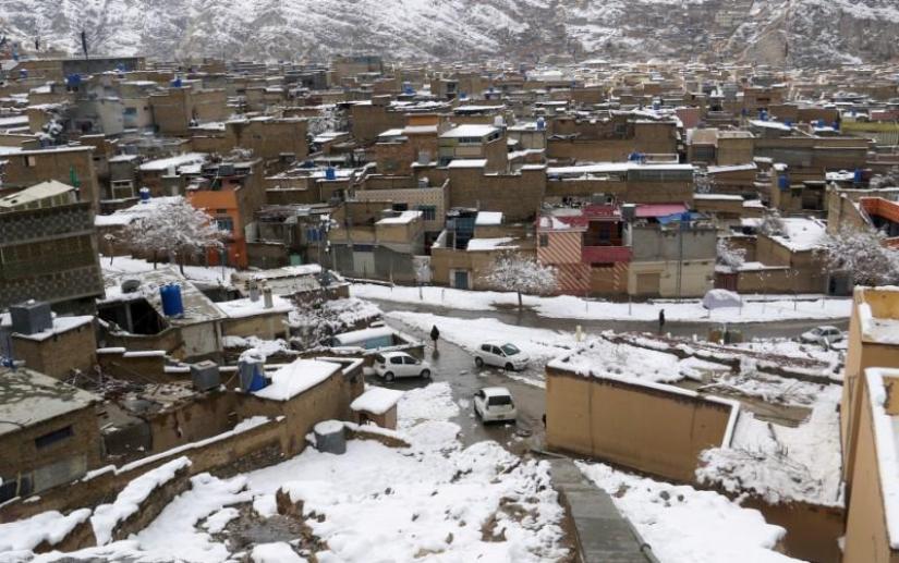 FILE PHOTO: A general view of residential area after a snowfall in Mariabad, Quetta, Pakistan Jan 13, 2020. REUTERS