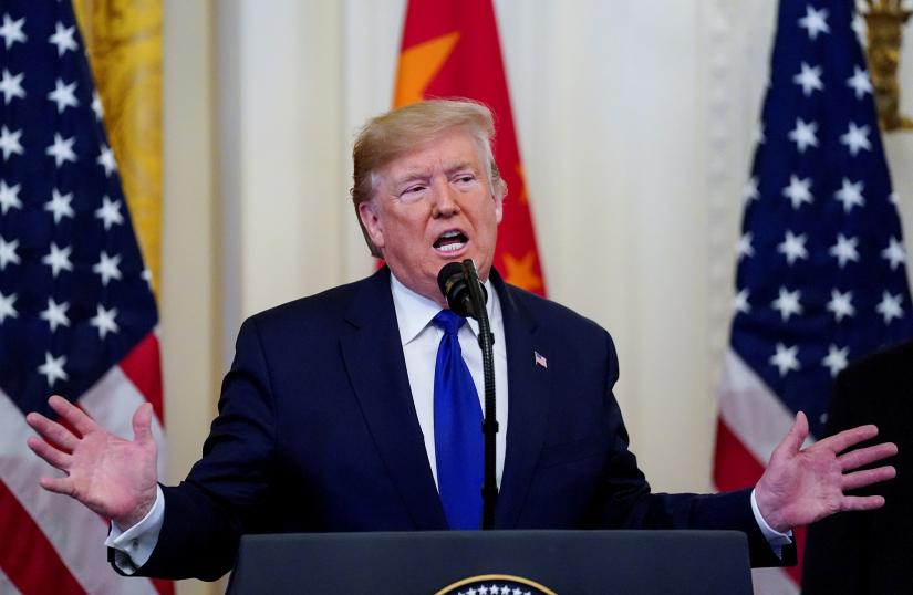 FILE PHOTO: US President Donald Trump speaks prior to signing `phase one` of the US-China trade agreement in the East Room of the White House in Washington, US, Jan 15, 2020. REUTERS