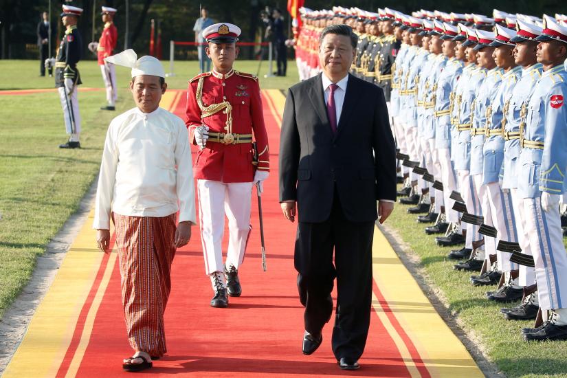 Chinese President Xi Jinping and Myanmar President Win Myint walk during a welcome ceremony at the Presidential Palace in Naypyitaw, Myanmar January 17, 2020. REUTERS