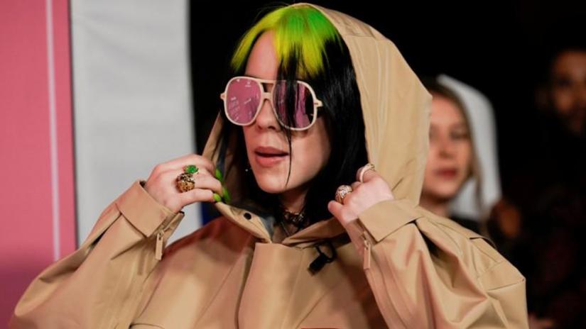 FILE PHOTO: American singer-songwriter Billie Eilish arrives on the red carpet for the `Billboard Women in Music` event in Los Angeles, California, US Dec 12, 2019. REUTERS