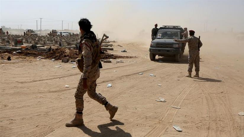 FILE PHOTO: Yemeni army soldiers secure a site in the south of the country after an attack last year. Reuters