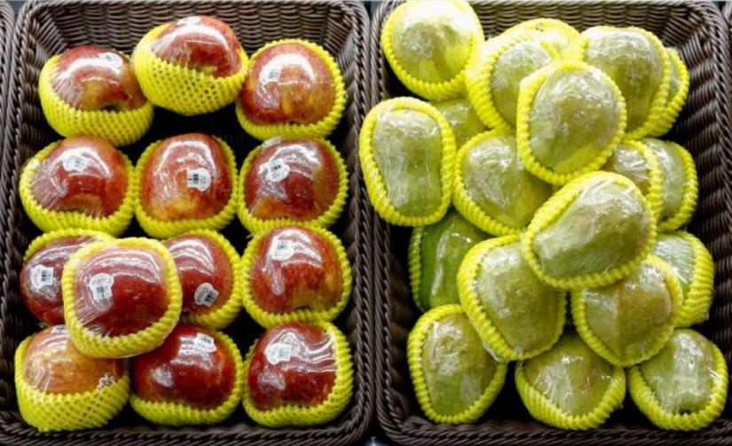 FILE PHOTO: Fruit packaged in plastic are on display at a supermarket in Beijing, China November 20, 2018. REUTERS