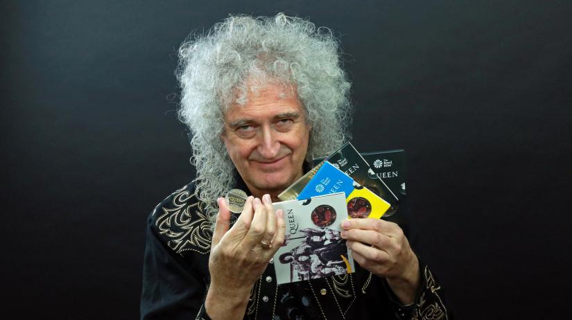 Guitarist Brian May of band Queen poses with a 5-pound in this undated picture obtained by Reuters on January 17, 2020. Courtesy of Queen Productions LTD/via REUTERS