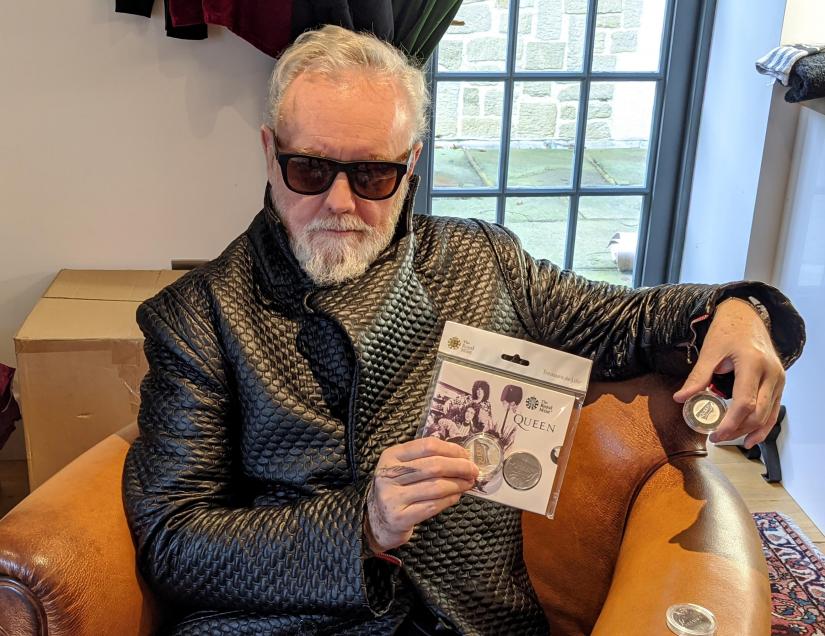 Drummer Roger Taylor of band Queen poses with a 5-pound in this undated picture obtained by Reuters on January 17, 2020. Courtesy of Queen Productions LTD/via REUTERS