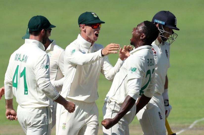 South Africa v England - Third Test - St George`s Park, Port Elizabeth, South Africa - January 16, 2020 South Africa`s Kagiso Rabada celebrates with teammates after taking the wicket of England`s Joe Root REUTERS