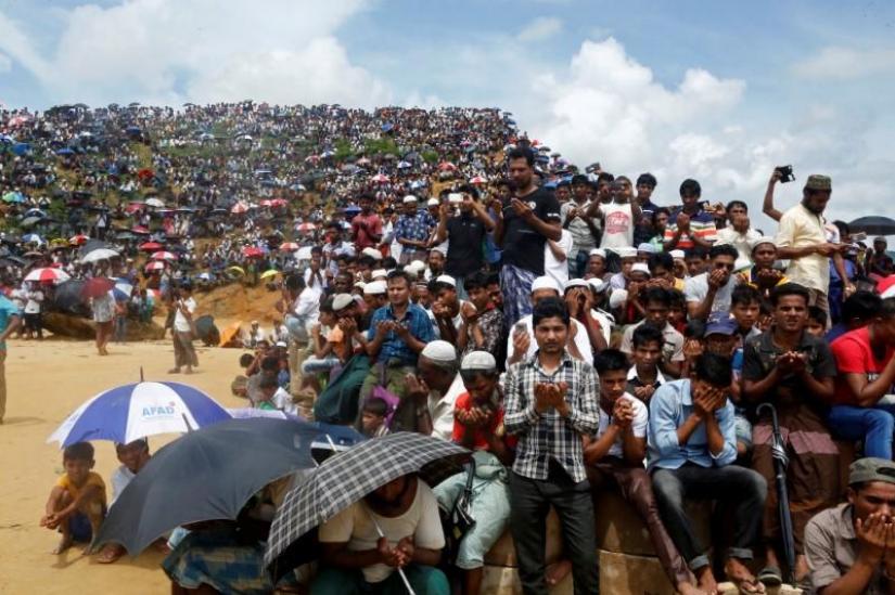 FILE PHOTO: Rohingya refugees take part in a prayer as they gather to mark the second anniversary of the exodus at the Kutupalong camp in Cox’s Bazar, Bangladesh, Aug 25, 2019. REUTERS