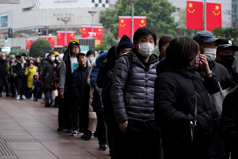 People line up outside a drugstore to buy masks in Shanghai, China Jan 24, 2020. REUTERS