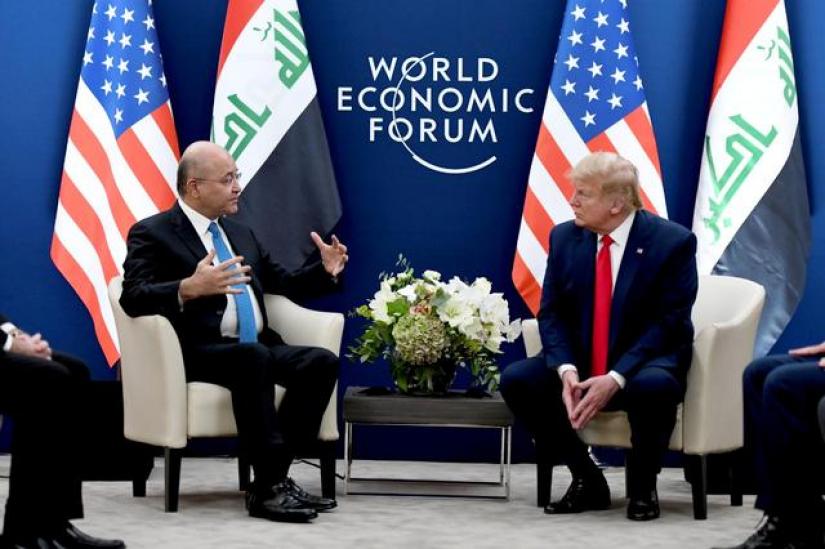 US President Donald Trump meets with Iraq`s President Barham Salih during the 50th World Economic Forum (WEF) annual meeting in Davos, Switzerland, Jan 22, 2020. The Presidency of the Republic of Iraq Office/Handout via REUTERS