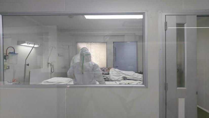FILE PHOTO: Staff and a patient are seen in Nakhon Pathom hospital, Nakhon Pathom Province, Thailand Jan 21, 2020. NAKHON PATHOM HOSPITAL/Handout via REUTERS