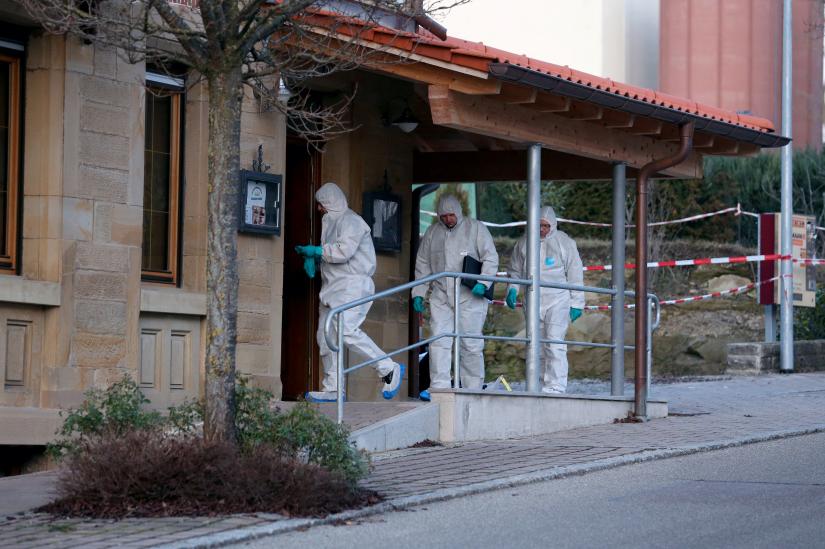 Forensic experts enter a house where a shooting took place, in Rot am See, Germany, January 24, 2020. REUTERS