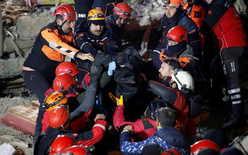 Rescue workers carry the body of an earthquake victim in Elazig, Turkey, Jan 26, 2020. REUTERS