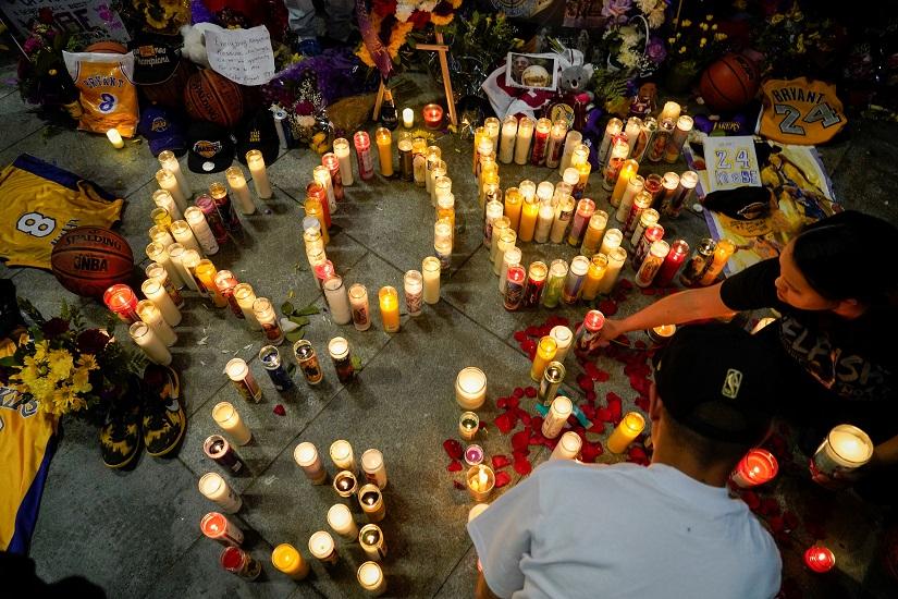 Mourners gather in Microsoft Square near the Staples Center to pay respects to Kobe Bryant after a helicopter crash killed the retired basketball star, in Los Angeles, California, US, Jan 26, 2020. REUTERS