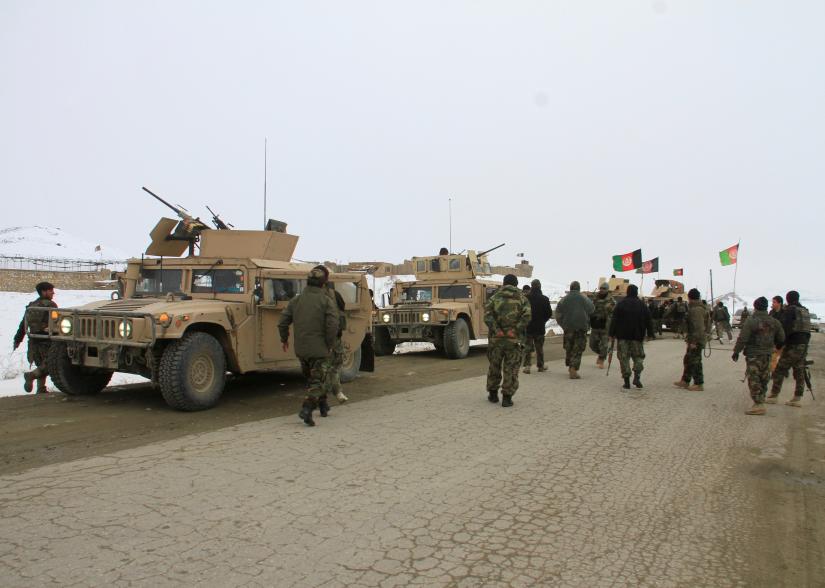 Afghan National Army forces go towards the site of an airplane crash in Deh Yak district of Ghazni province, Afghanistan January 27, 2020. REUTERS