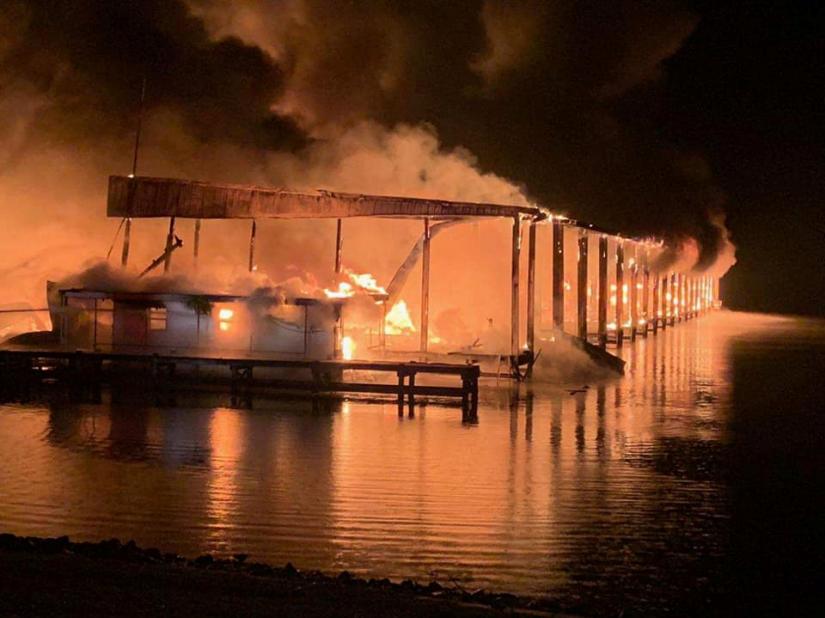 A row of boats are engulfed in flames after catching fire at the marina in Scottsboro, Alabama, U.S. January 27, 2020. Southern Torch via REUTERS