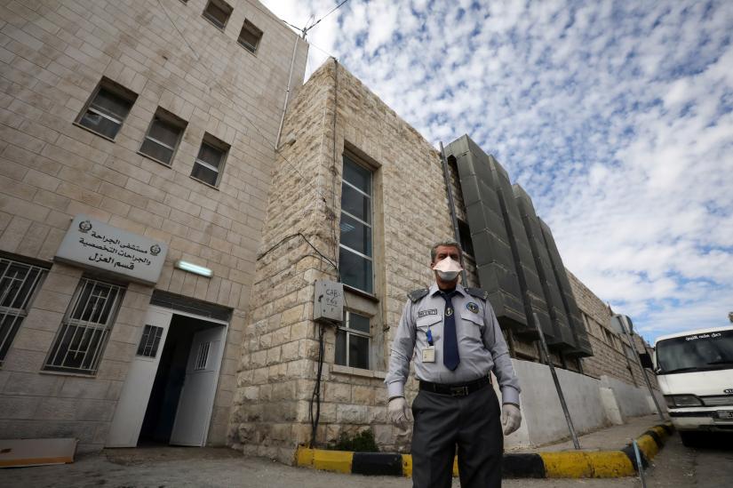 A security officer stands in front of a new section, specialised in receiving any person who may have been infected with coronavirus, at the Al-Bashir Governmental Hospital in Amman, Jordan January 28, 2020.REUTERS