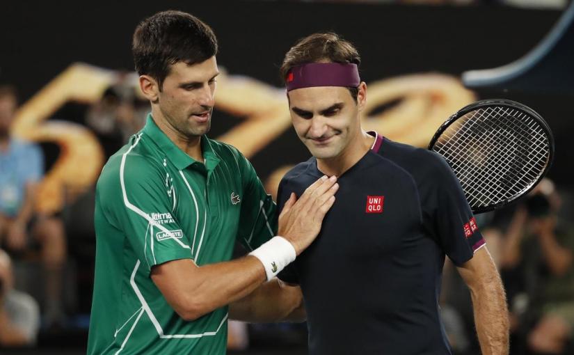 Australian Open - Semi Final - Melbourne Park, Melbourne, Australia - January 30, 2020. Serbia`s Novak Djokovic and Switzerland`s Roger Federer hug each other after their match. Reuters