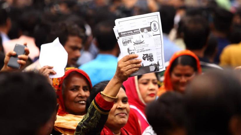 A woman is seen holding a leaflet during the campaign of  Awami League`s mayor candidate for Dhaka North City Corporation on Thursday (Jan 30).