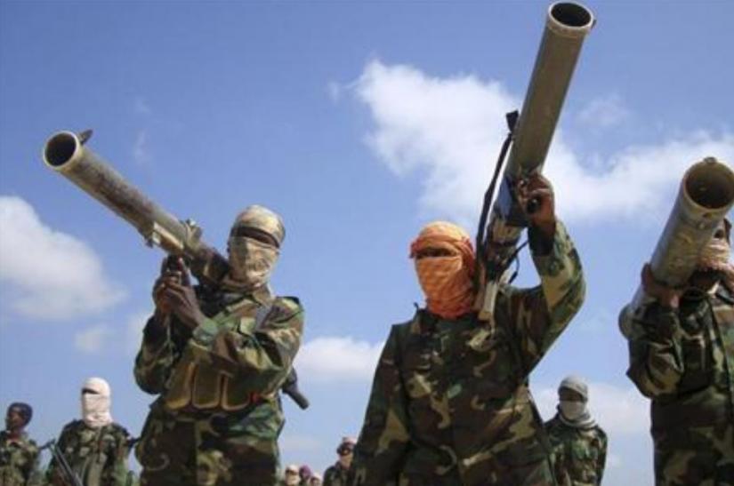 Members of the hardline al Shabaab Islamist rebel group hold their weapons in Somalia`s capital Mogadishu, January 1, 2010. REUTERS