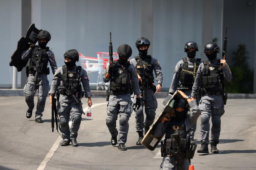 Thai security forces leave the Terminal 21 mall after completing their mission to stop a soldier on a rampage after a mass shooting, Nakhon Ratchasima, Thailand Feb 9, 2020. REUTERS