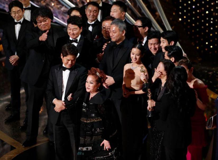 Miky Lee, Kwak Sin Ae and Bong Joon Ho react after winning the Oscar for Best Picture for `Parasite` at the 92nd Academy Awards in Hollywood, Los Angeles, California, US, Feb 9, 2020. REUTERS