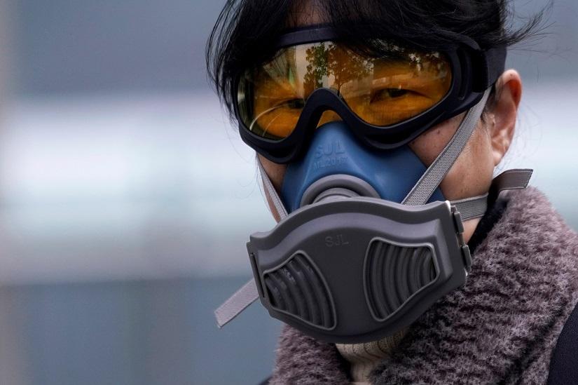 A woman wearing a mask is seen at a subway station in Shanghai, China, as the country is hit by an outbreak of the novel coronavirus, Feb 13, 2020. REUTERS