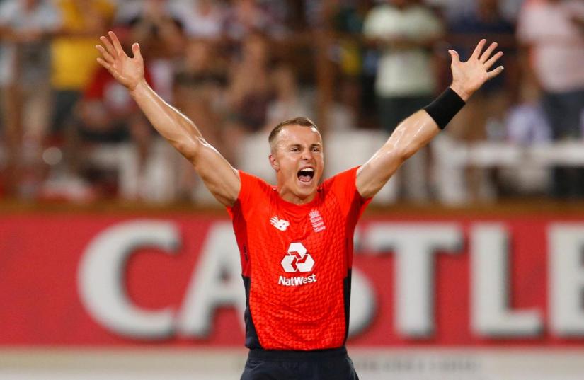 Cricket - South Africa v England - Second T20 - Kingsmead Cricket Ground, Durban, South Africa - Feb 14, 2020 England`s Tom Curran celebrates taking the wicket of South Africa`s Dwaine Pretorius REUTERS