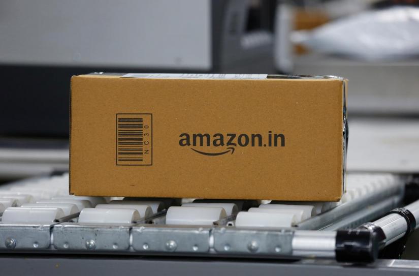 FILE PHOTO: A shipment moves on a conveyor belt at an Amazon Fulfillment Centre (BLR7) on the outskirts of Bengaluru, India, Sept 18, 2018. REUTERS