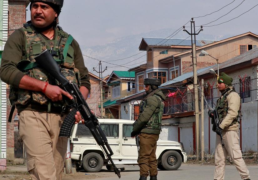 FILE PHOTO: Indian security forces stand guard at the site of a grenade explosion in Srinagar Feb 6, 2020. REUTERS