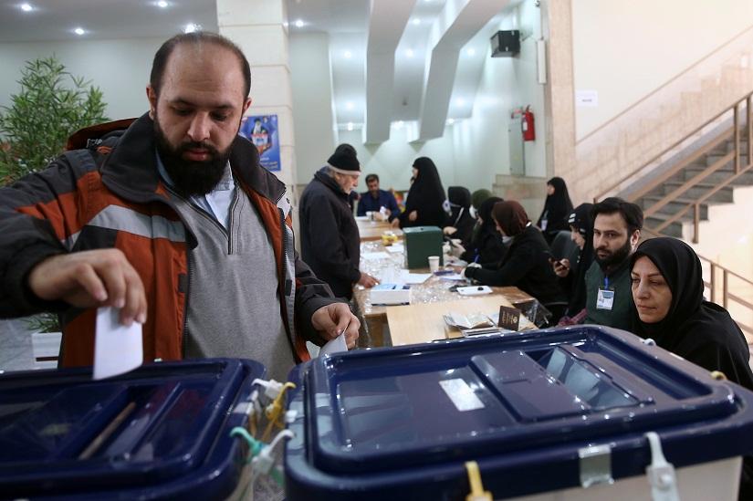 A man casts his vote during parliamentary elections at a polling station in Tehran, Iran Feb 21, 2020. Nazanin Tabatabaee/WANA (West Asia News Agency) via REUTERS
