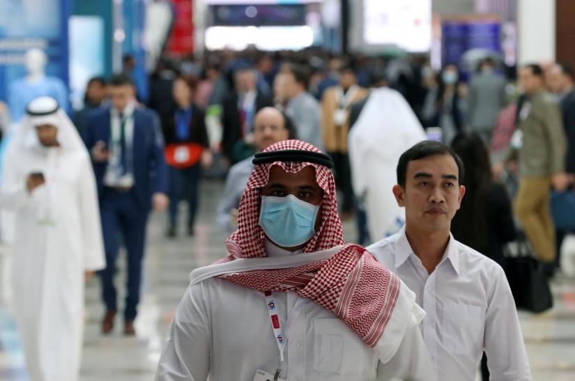 FILE PHOTO: A vistor wears a mask during the Arab Health Exhibition in Dubai, United Arab Emirates Jan 29, 2020. REUTERS