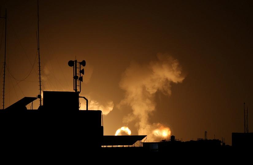 Flame and smoke are seen during Israeli air strikes in the southern Gaza Strip Feb 23, 2020. REUTERS