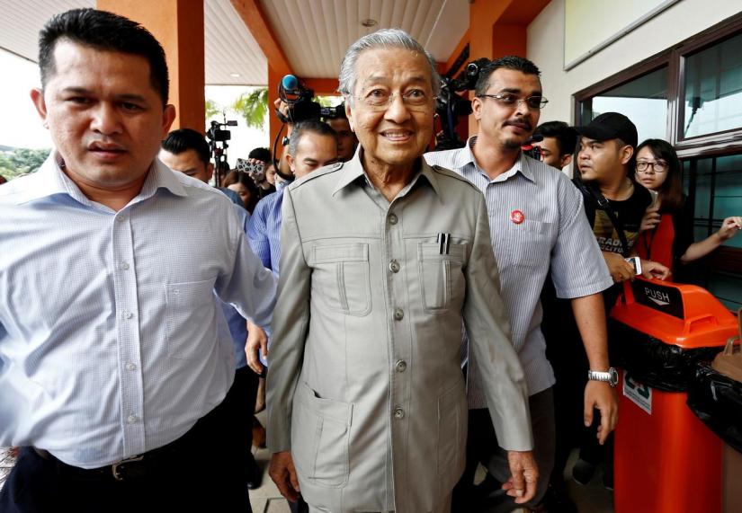 FILE PHOTO: Former Malaysian Prime Minister Mahathir Mohamad arrives to visit jailed opposition leader Anwar Ibrahim, who is recuperating from surgery, at Cheras Rehabilitation Hospital in Kuala Lumpur, Malaysia Jan 10, 2018. REUTERS