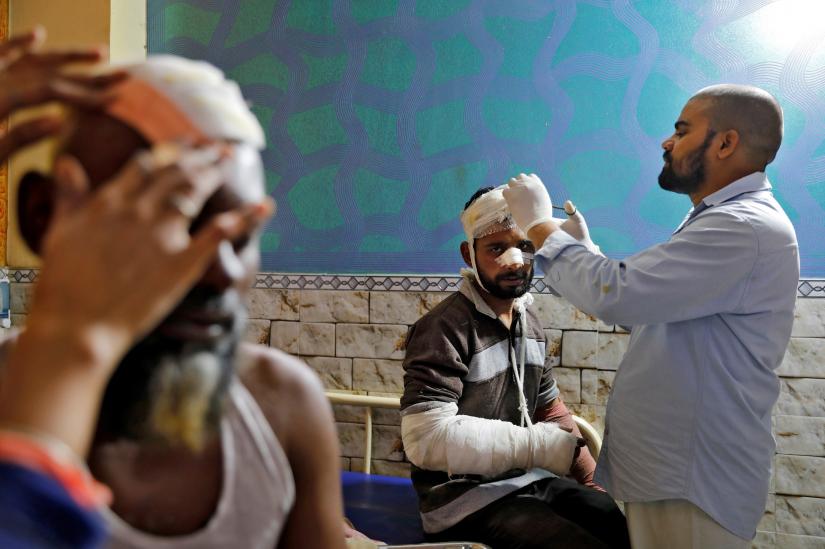 Muslim men are treated at Al-Hind hospital after they were injured in a clash between people demonstrating for and against a new citizenship law in a riot affected area in New Delhi, India February 27, 2020. Picture taken February 27, 2020. REUTERS