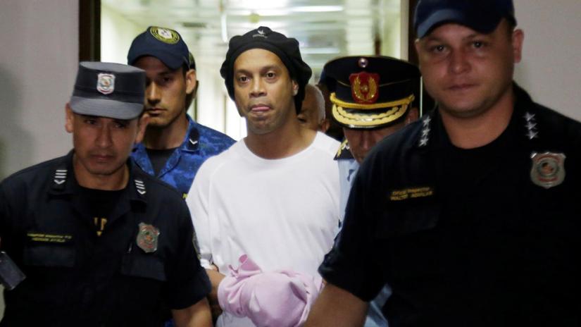 Paraguayan Supreme Court, Asuncion, Paraguay - Mar 7, 2020- Ronaldinho handcuffed and escorted by police at the Supreme Court of Paraguay REUTERS