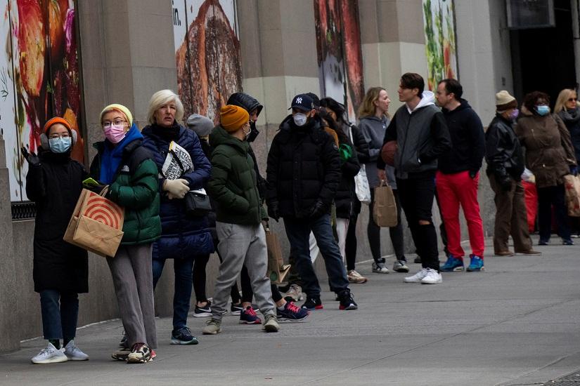 People line up to buy food in a market as the coronavirus disease (COVID-19) outbreak continues in New York, US, Mar 22, 2020. REUTERS