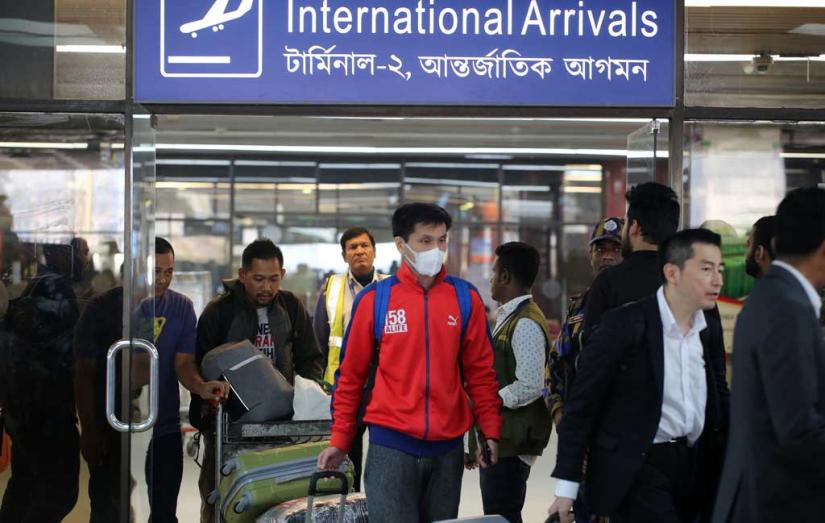 International flight passengers exit the international arrivals terminal of Hazrat Shahjalal International Airport on Tuesday, January 28, 2020 FILE PHOTO/Syed Zakir Hossain
