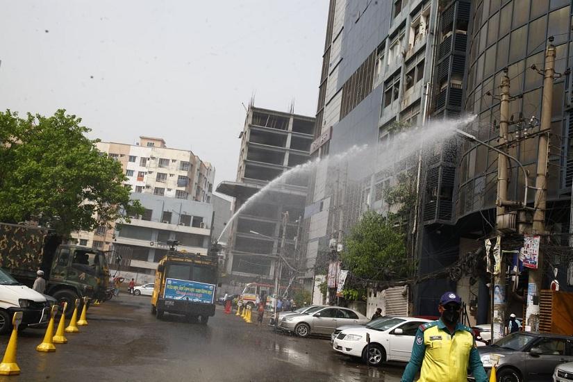 DMP`s water canon spraying germicide on a Dhaka street. Photo/Nashirul Islam