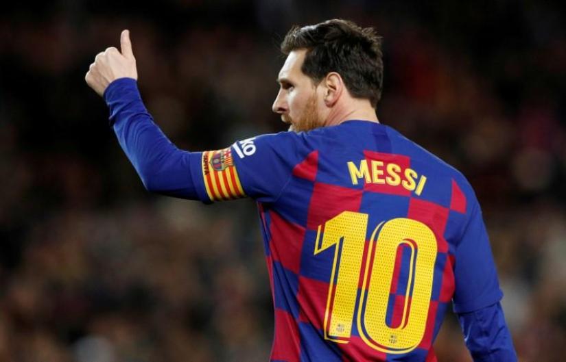 FILE PHOTO: Soccer Football - La Liga Santander - FC Barcelona v Real Sociedad - Camp Nou, Barcelona, Spain - March 7, 2020 Barcelona`s Lionel Messi celebrates scoring their first goal REUTERS
