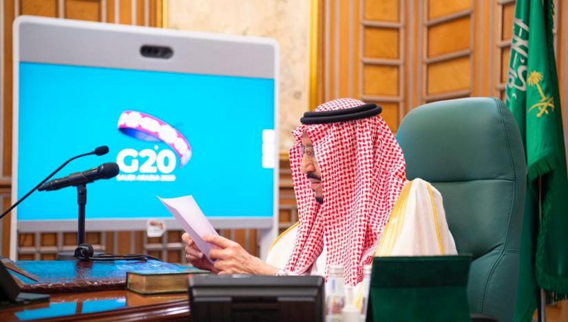 Saudi King Salman bin Abdulaziz speaks via video link during a virtual G20 summit on coronavirus disease (COVID-19), in Riyadh, Saudi Arabia March 26, 2020. Bandar Algaloud/Courtesy of Saudi Royal Court/Handout via REUTERS