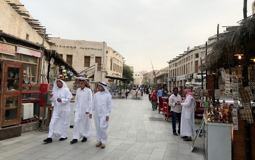 People walk at souq Waqif, following the outbreak of coronavirus, in Doha, Qatar March 12,2020. REUTERS