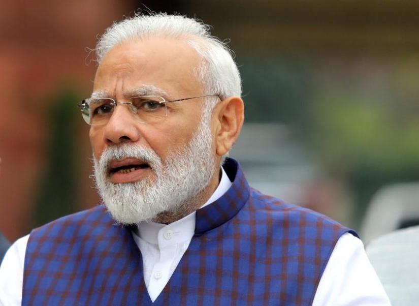 FILE PHOTO: Prime Minister Narendra Modi speaks to the media inside the parliament premises on the first day of the winter session in New Delhi, Nov 18, 2019. REUTERS