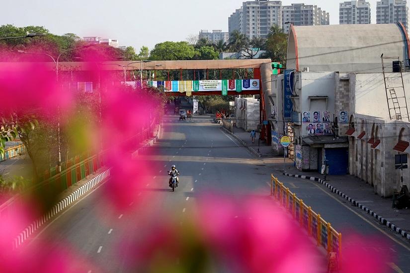 A commuter rides on a bike on an empty street during countrywide lockdown due to coronavirus disease (COVID-19) outbreak in Dhaka, Bangladesh, Mar 28, 2020. REUTERS