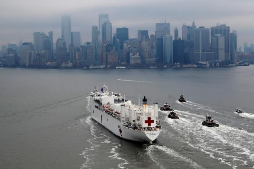 The USNS Comfort passes Manhattan as it enters New York Harbor during the outbreak of the coronavirus disease (COVID-19) in New York City, US, Mar 30, 2020. REUTERS
